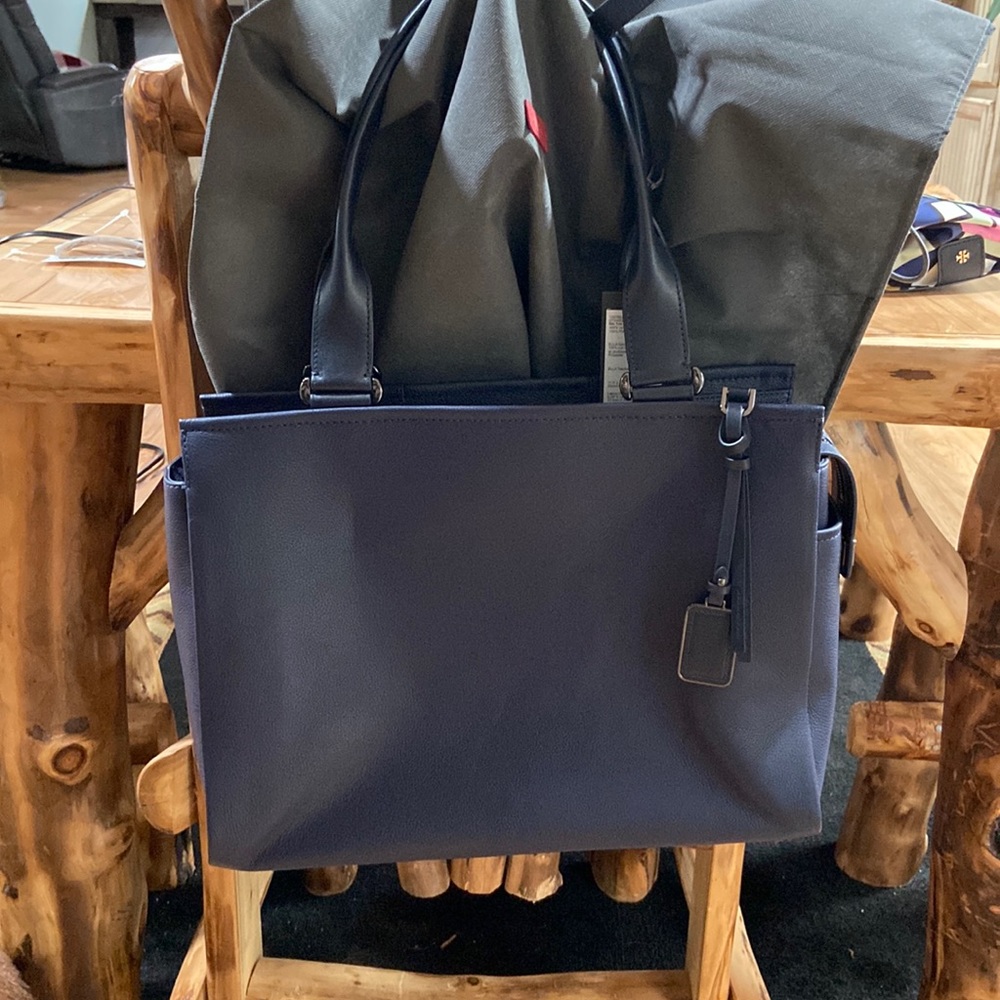 Never used.  Tumi Ella Tote